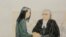 孟晚舟和她的律师周一在法庭上。为了让孟晚舟获得保释，她的律师戴维·马丁提出愿意接受严格的监控措施作为保释条件。（2018年12月10日）