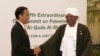 Indonesian President Joko "Jokowi" Widodo, left, greets his Sudanese counterpart Omar al-Bashir upon his arrival for the extraordinary Organization of Islamic Cooperation (OIC) summit on Palestinian issues in Jakarta, Indonesia, Monday, March 7, 2016.