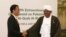 Indonesian President Joko "Jokowi" Widodo, left, greets his Sudanese counterpart Omar al-Bashir upon his arrival for the extraordinary Organization of Islamic Cooperation (OIC) summit on Palestinian issues in Jakarta, Indonesia, Monday, March 7, 2016.