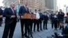 New York City Police Commissioner Bill Bratton, left, listens as New York City Mayor Bill de Blasio speaks during a news conference in Times Square about security enhancements in the city, March 22, 2016.
