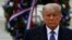 President Donald Trump participates in a Veterans Day wreath laying ceremony at the Tomb of the Unknown Soldier at Arlington National Cemetery in Arlington, Va., Nov. 11, 2020.