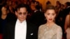 Actor Johnny Depp and his fiancee, model Amber Heard, arrive at the Metropolitan Museum of Art Costume Institute Gala Benefit celebrating the opening of "Charles James: Beyond Fashion" in Upper Manhattan, New York, May 5, 2014. REUTERS/Lucas Jackson (UN