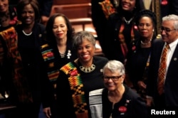 Democratic female members of Congress, wearing black to support the #MeToo movement and buttons referring to 1944 rape victim Recy Taylor, arrive on the House floor to watch U.S. President Donald Trump deliver his State of the Union address to a joint session of the U.S. Congress on Capitol Hill in Washington, Jan. 30, 2018.