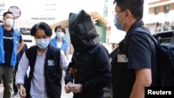 香港警方2021年7月22日对出版“煽动性刊物”嫌疑人展开逮捕行动（路透社）