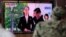 FILE - A man watches a TV screen showing a news program with a file image of Kim Yo Jong, the powerful sister of North Korea's leader Kim Jong Un, at the Seoul Railway Station in Seoul, South Korea, June 4, 2020. 