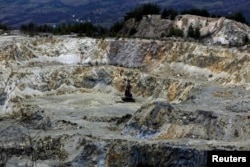 FILE - A general view of an old quarry near Rosia Montana, central Romania, March 24, 2014. In a surprise move this week, the outgoing Romania government submitted an application to UNESCO to designate Rosia Montana a World Heritage site.