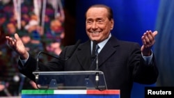 Former Italian Prime Minister and leader of the Forza Italia (Go Italy!) party Silvio Berlusconi gestures during a rally ahead of a regional election in Emilia-Romagna, in Ravenna, Jan. 24, 2020. 