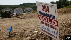 Construction is underway at a housing development in Zelienople, Pennsylvania, Sep. 10, 2014.