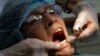 FILE - A dentist's visit.