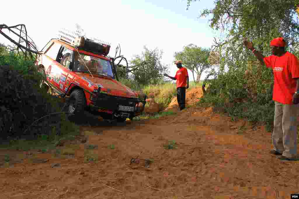 Car 20, the Ranger Team, negotiates a hill, June 2, 2012. (VOA/Jill Craig)