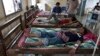 This Aug. 26, 2009 photo shows patients suffering from malaria being treated at the hospital in Pailin, Cambodia. 