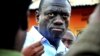 FILE - Ugandan opposition leader Kizza Besigye speaks to journalists.