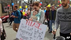 About 1,000 Mormons and former Mormons march to the church's headquarters in Salt Lake City, March 30, 2018. The Church of Jesus Christ of Latter-day Saints changed its policy this week to allow children to bring a parent or adult with them to a meeting with their church leader. The protesters say that doesn't go far enough.