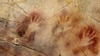 Hand prints dating from 37,000 years ago, and a red disk from 40,600 years ago (not pictured), in El Castillo Cave in Spain, are the oldest cave paintings in Europe. (Pedro Saura)