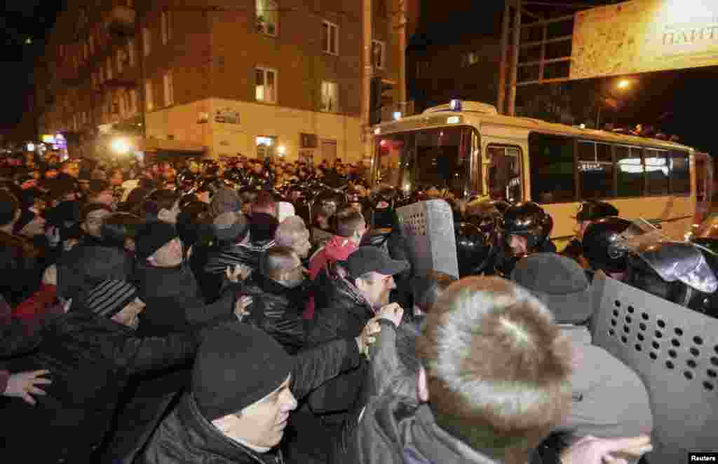 Pro-Russian demonstrators clash with riot police during a protest rally in Donetsk, Ukraine, March 6, 2014.