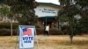 FILE - Voters return to their vehicles after early voting for the Senate runoff election, at Ron Anderson Recreation Center, Dec. 17, 2020, in Powder Springs, Ga. 