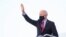 US President Joe Biden waves while boarding Air Force One as he departs Washington for travel to Wilmington, Delaware, at Joint Base Andrews, Maryland, Feb. 5, 2021. 