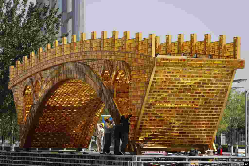 A man reacts as a medical worker takes a sample from inside his nose in Wuhan in China&#39;s central Hubei province.