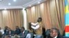 Democratic Republic of Congo's newly-appointed Prime Minister Matata Ponyo Mapon (R) talks surrounded by his cabinet ministers during a press point at the Finance ministry in Kinshasa, DRC, April 19, 2012.
