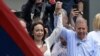 Venezuelan opposition leader Maria Corina Machado rises the hand of opposition presidential candidate Edmundo Gonzalez Urrutia during a rally in front of the United Nations headquarters in Caracas on July 30, 2024.