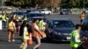 FILE -Food is loaded as drivers in their vehicles wait in line on arrival at a "Let's Feed LA County" food distribution hosted by the Los Angeles Food Bank in Hacienda Heights, California, Dec. 4, 2020.