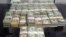 This 2014 U.S. Customs and Border Protection photo shows $189,300 in unreported U.S. currency seized from a Mexican man who attempted to smuggle the cash into the United States.