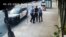 FILE - This image from video shows Minneapolis police Officers Thomas Lane, left and J. Alexander Kueng, right, escorting George Floyd, center, to a police vehicle outside Cup Foods in Minneapolis, on May 25, 2020. 