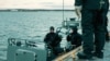 FILE - Navy divers of the Latvian Armed Forces take part in NATO exercise Freezing Winds 24, led by the Finnish Navy, in the Gulf of Finland, the Baltic Sea, Finland, Nov. 23, 2024. 