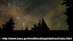 In this 30 second exposure, a meteor streaks across the sky during the annual Perseid meteor shower, Wednesday, Aug. 11, 2021, in Spruce Knob, West Virginia. Photo Credit: (NASA/Bill Ingalls)