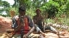 FILE - Young goldminers crush rocks to find gold dust on June 3, 2008 at the Kambele III site near the eastern Cameroonian town of Batouri.
