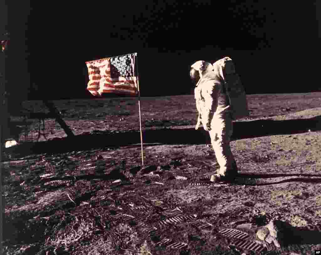 In this image provided by NASA, astronaut Buzz Aldrin poses for a photograph beside the U.S. flag deployed on the moon during the Apollo 11 mission on July 20, 1969. (Neil A. Armstrong/NASA via AP, File)