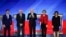 From left, Democratic presidential candidates Pete Buttigieg, Sen. Bernie Sanders, Joe Biden, Elizabeth Warren, and Amy Klobuchar, are seen ahead of their primary debate at Saint Anselm College in Manchester, New Hampshire, Feb. 7, 2020. 