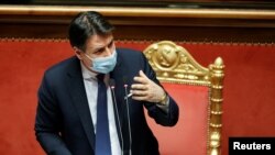 FILE - Italian Prime Minister Giuseppe Conte speaks ahead of a confidence vote at the upper house of parliament, in Rome, Jan. 19, 2021.