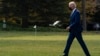 FILE - President Joe Biden walks to board Marine One on the South Lawn of the White House for a trip, in Washington, Nov. 30, 2021. 
