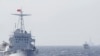 FILE - Ships of Chinese Coast Guard are seen near Chinese oil rig Haiyang Shi You 981 in the South China Sea, about 210 km (130 miles) off shore of Vietnam, May 14, 2014. 