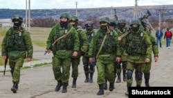 Ukraine – Russian military forces invaded Crimea peninsula. Russian soldiers (faces) in Perevalne, Crimea, March 5, 2014
