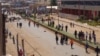 FILE - Anti-government demonstrators block a road in Bamenda, Cameroon, Dec. 8, 2016. 