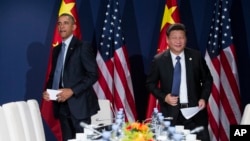 美国总统奥巴马和中国主席习近平在联合国气候大会上（2015年11月30日）