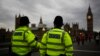 FILE - Police officers patrol Westminster Bridge with the Houses of Parliament in the background, in London, Britain, June 8, 2017.