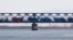 FILE - Trucks drive on the Friendship Bridge over the Yalu River which connects North Korea's Sinuiju to China's Dandong, April 11, 2013.