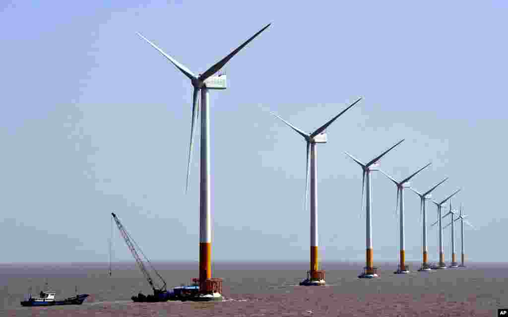 Wind turbines of the Donghai Bridge Offshore Wind Farm are seen near Shanghai. While China is the world&rsquo;s largest polluter, it is also the world&rsquo;s largest producer of wind energy, and hopes to double its production over the next six years. 