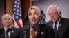 FILE - Representative Ilhan Omar, Democrat-Minnesota, center, is seen with fellow lawmakers during a news conference on Capitol Hill in Washington, Jan. 10, 2019.