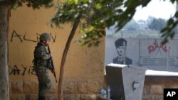 A Turkish soldier stands at the border with Syria in Akcakale, Sanliurfa province, southeastern Turkey, Thursday, Oct. 10, 2019. (AP Photo/Lefteris Pitarakis)