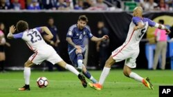 People walk in a field of fireweed, or Kochia scoparia, at the Hitachi Seaside Park in Hitachinaka, Japan.Fireweed is a grass bush that takes on a bright red color in autumn.
