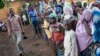 FILE - Refugees from Central Africa wait in Cameroonianian Garoua Boulaï border town for foods and clothes delivering by humanitarian associations. 