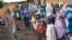 FILE - Refugees from Central Africa wait in Cameroonianian Garoua Boulaï border town for foods and clothes delivering by humanitarian associations. 
