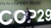 Peserta konferensi terlihat berjalan melewati logo COP29 dalam Konferensi Perubahan Iklim PBB yang berlangsung di Baku, Azerbaijan, pada 21 November 2024. (Foto: AFP)