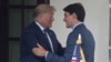 (FILES) US Presidnt Donald Trump greets Canadian Prime Minister Justin Trudeau at the White House in Washington, DC, on June 20, 2019.