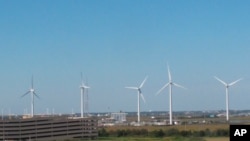 This Oct. 1, 2020 photo shows windmills at a utility plant in Atlantic City N.J. On Nov. 18, 2020, New Jersey committed itself to building a transmission system capable of handling enough offshore wind energy to power 3.2 million homes. 