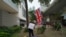 A pro-democracy supporter waves a British flag outside a court in Hong Kong Friday, April 16, 2021. Seven of Hong Kong’s leading pro-democracy advocates, including 82-year-old veteran activist Martin Lee and pro-democracy media tycoon Jimmy Lai, are…
